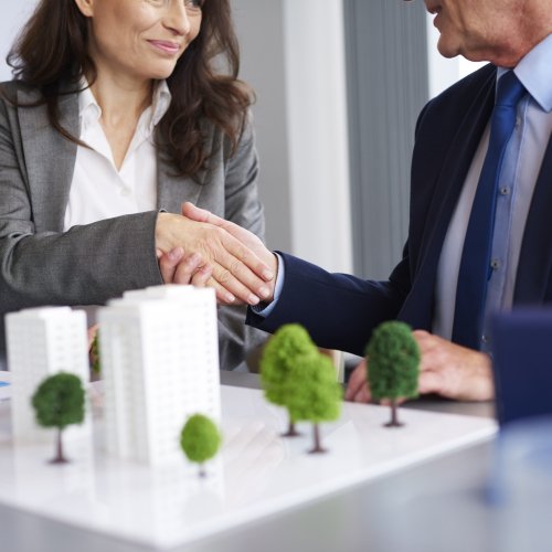 Close up of business partners shaking hands Close up of business partners shaking hands